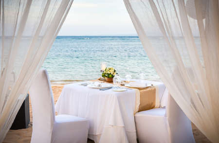 Romantic table setting in the evening on Bali island, Indonesiaの写真素材