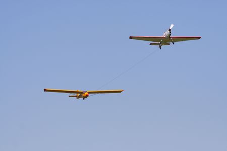Aircraft with sail-plane on the ropeの写真素材
