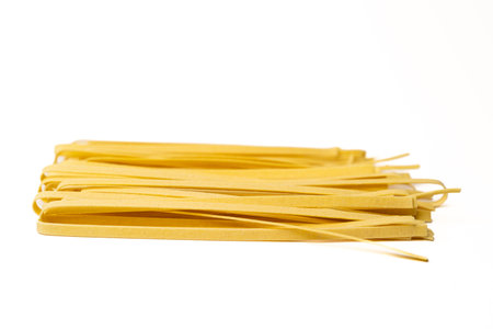 Tagliatelle pasta on a white backgroundの写真素材