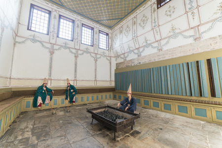Wax Sculptures Of A Braided Guards Heating Up Brazier And Smoking Pipes Zuluflu Baltaci Inside Topkapi Palace, Istanbul, Turkeyのeditorial素材