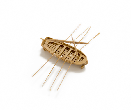 Small Model Of A Row Boat Isolated On White Surfaceの写真素材