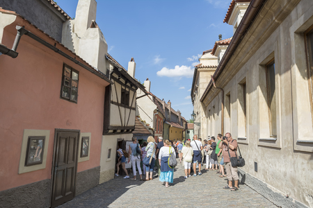 Tourist group visiting souvenir shop at the famous golden street named Zlata Ulicka at Prague Castle Complex.のeditorial素材