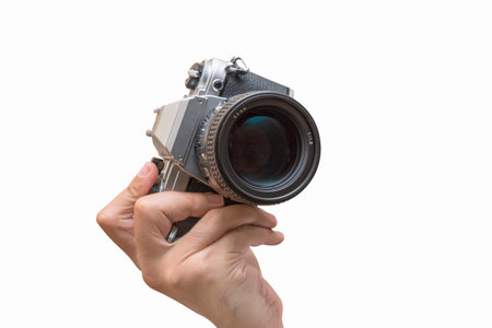 Hand Holding Vintage Camera Isolated On White Background