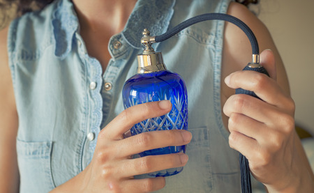 Woman Spraying Perfumeの写真素材