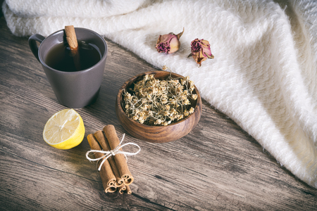 Cinnamon Sticks And Dried Linden Tea On A Wooden Surfaceの写真素材