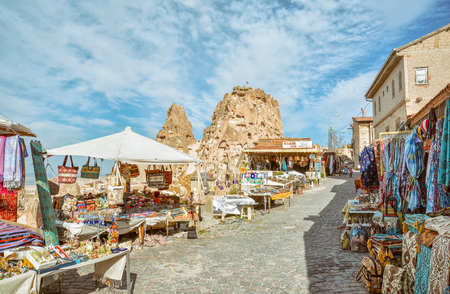 Road with souvenir shops from Uchisar village, famous with its landmark castle known as one of the first settlements of early christians. Nevsehir, Turkey.のeditorial素材