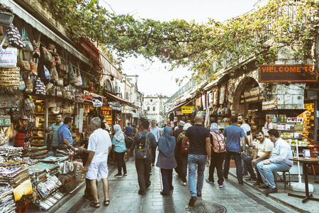 People walking and shopping at streets near to Grand Bazaar (Kapali Carsi), one of the largest and oldest covered markets in the world.  Istanbul, Turkey.のeditorial素材