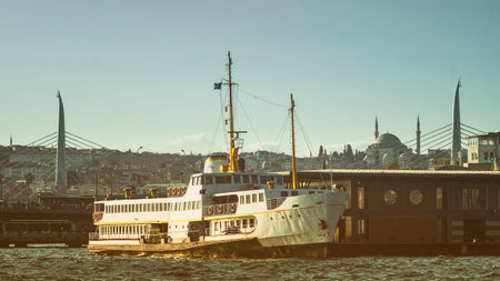 Passenger Ferry Docked At Karakoy Pier, Galata Bridge and Metro Bridge At Background, Istanbul,...