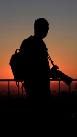 Silhouette Of A Photographer At Sunset