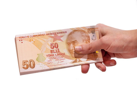 Female Hand Holding 50 Turkish Lira Banknotes, Isolated On White Background
