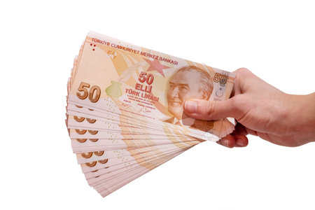 Female Hand Holding 50 Turkish Lira Banknotes, Isolated On White Background