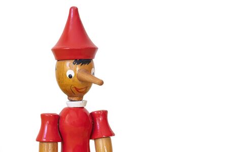 Close Up Head Shot Of A Wooden Pinocchio Toy, Isolated On White Backgroundの写真素材