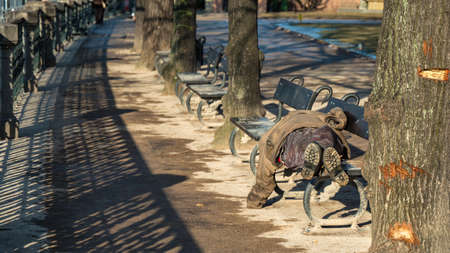 Homeless Man on a Benchの写真素材