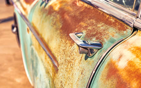 Old Car Door Handle, Cracked Sun-Faded Paintの写真素材
