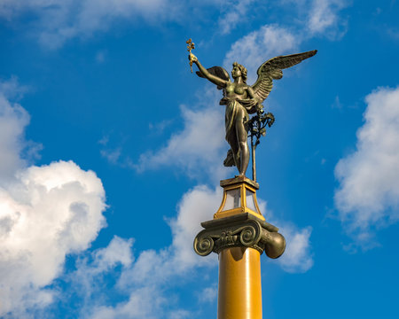 Cechuv Bridge in Prague - A Historic Bronze Statue Of A Standing Angel With Stretched Out Wings