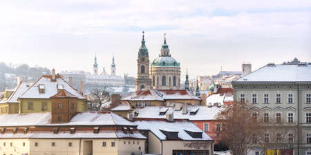 Prague Panorama of the Church of St. Nicholas and Strahov Monastery, Winter Time, Wideの写真素材