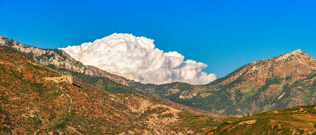 Panoramic Landscape of Mountains and Coming Storm, Changing Weather in Natureの写真素材