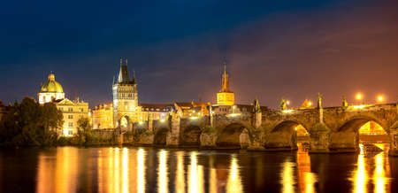 Panoramic View of Illuminated Charles Bridge, Old Gothic Tourist Site in Prague - Capital of Czech Republicの写真素材