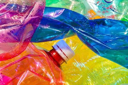 Crushed and Crumpled Beverage Bottles of Different Colors and Shapes, Plastic Waste Ready for Recyclingの写真素材