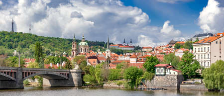 Panorama of European City with View of Lesser Town Petrin Hill, Church of St. Nicholas and Strahov Monastery, Prague, Czech Republicの写真素材
