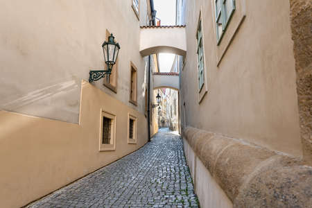 European Side Street, Bright Alley Way with Arches Overhead - Traveling in Old Town Prague City Centerの写真素材
