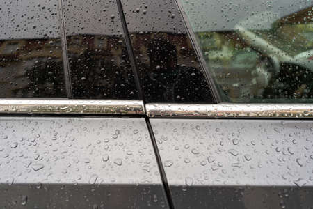 Problems with Fitting Individual Parts of a New Car, Visible Inaccuracy of the Chrome Decorative Strip, Low Quality Control, Panel and Trim are Misalignedの写真素材