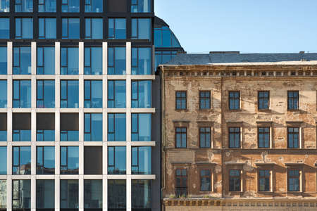Front View of a Commercial Office and Apartment Building in the City Center, Typical Modern and Old Classic Architecture Side by Sideの写真素材