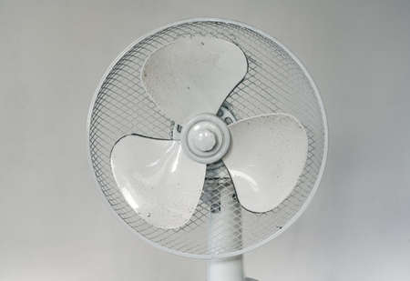 Dirty Fan Showing Polluted Air in the Interior of the House, Hazardous Environment for Allergy Sufferers, Household Appliance Requiring Regular Maintenanceの写真素材