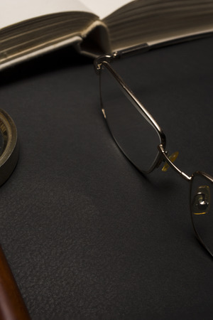 Ophthalmologist concept with book, eyeglasses and magnifying glass. High resolution image.の写真素材