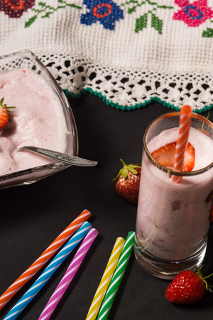 Strawberry smooothie with straberries in the background. High resolution image.の写真素材