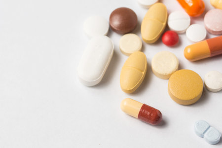 Multiple pills depicting medical treatment or pahrmaceutical industry. High resolution image.