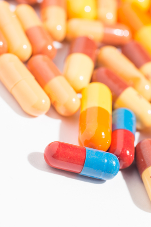 Multiple pills depicting medical treatment or pahrmaceutical industry. High resolution image.の写真素材