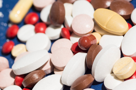 Multiple pills depicting medical treatment or pahrmaceutical industry. High resolution image.の写真素材