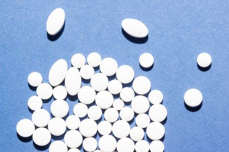 Multiple pills depicting medical treatment or pahrmaceutical industry. High resolution image.