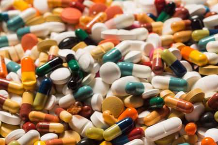 Multiple pills depicting medical treatment or pahrmaceutical industry. High resolution image.の写真素材