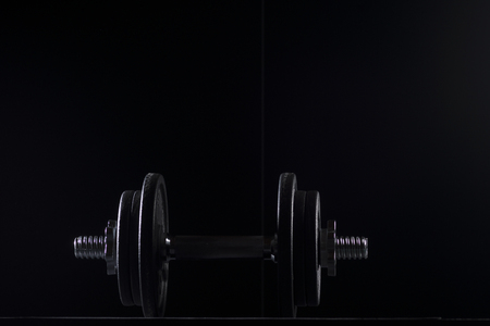 Bodybuilding weights concept on black background. High resolution image concept for bodybuiding or fitness industry.の写真素材