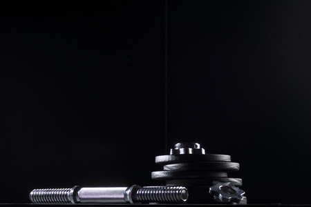 Bodybuilding weights concept on black background. High resolution image concept for bodybuiding or fitness industry.の写真素材