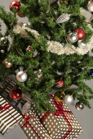 Christmas tree with presents underneath. High resolution image for Christmas Holliday.の写真素材