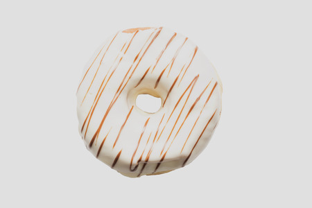 White chocolate glazed doughnut on white background. High resolution image for food industry.の写真素材