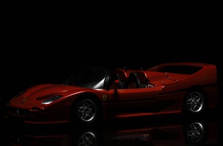 Red Ferrari F50 on black background. High resolution image for automotive industry.のeditorial素材