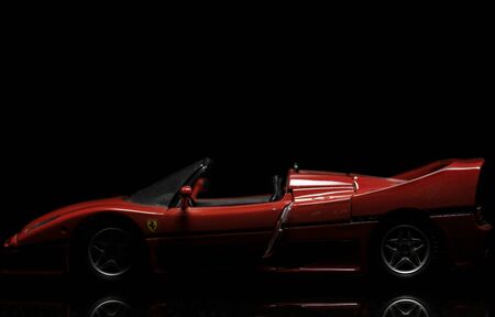 Red Ferrari F50 on black background. High resolution image for automotive industry.のeditorial素材