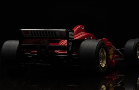 Vintage red Ferrari Formula 1 car on black background. High resolution image for racing industry.のeditorial素材