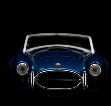 Shelby Cobra 427 on black background. High resolution image for automotive industry.