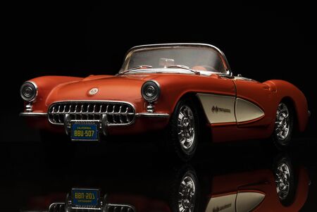 Orange Chevrolet Corvette 1957 on black background. High resolution image for automotive industry.のeditorial素材