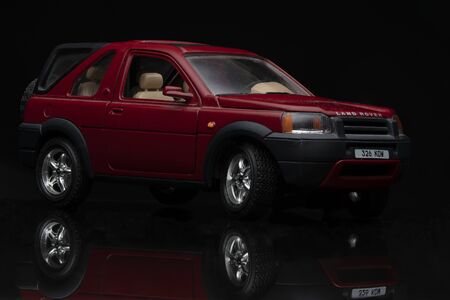 Red Land Rover Freelander on black background. High resolution image for automotive industry.のeditorial素材