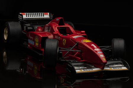Vintage red Ferrari Formula 1 car on black background. High resolution image for racing industry.のeditorial素材