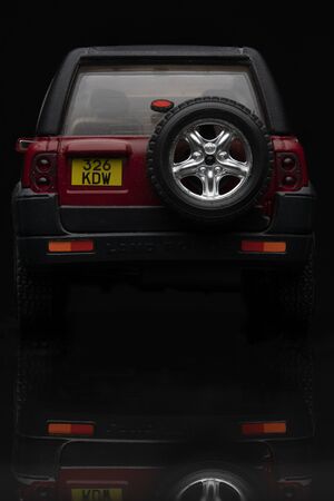 Red Land Rover Freelander on black background. High resolution image for automotive industry.のeditorial素材