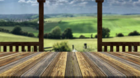 Rustic wood tabletop on blur landscape backgroundの写真素材