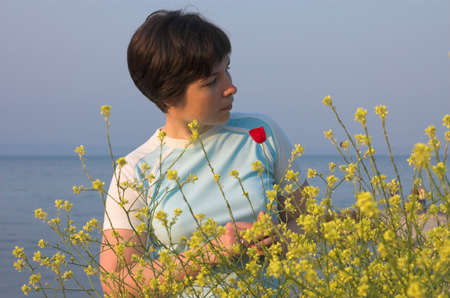 Girl with a poppy watch ouutside, Halkidiki, Greeceの写真素材