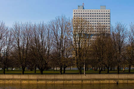 Modern office building and park at the quay in centre of  Moscow, Russiaの写真素材